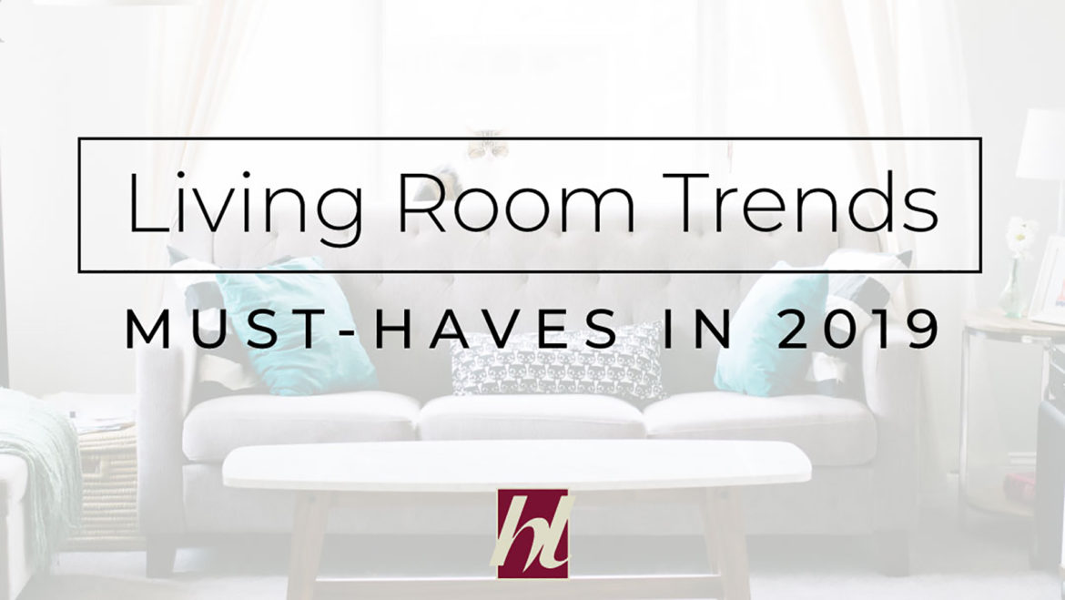 A House Lift Inc. blog banner features a modern living room couch with coffee table with the text Living Room Trends - Must-Haves In 2019