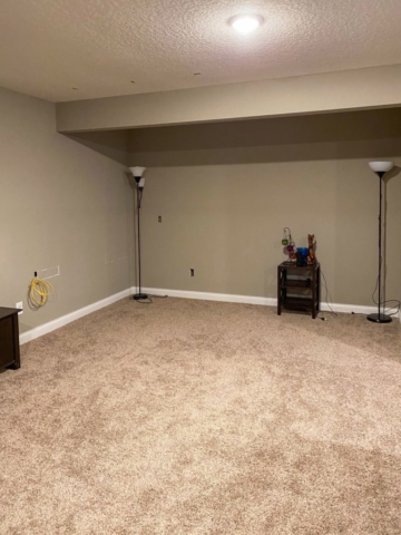 Empty room before it was turned into a basement bar by House Lift remodeling contractors of the Twin Cities