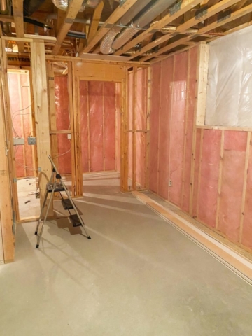 A home gym mid-renovation features insulation and framing in a home being renovated by House Lift Inc. of the Twin Cities