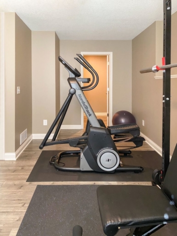 A residential personal gym includes work out equipment recently renovated by House Lift Inc. of the Twin Cities
